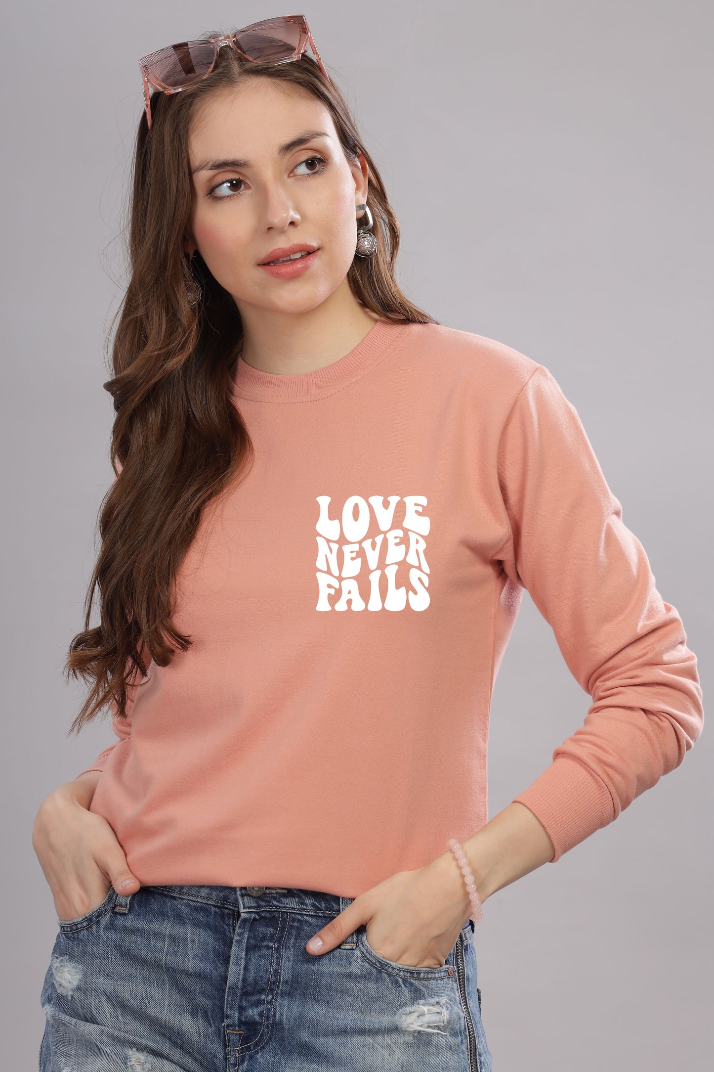 Love Never Fails Women’s Sweatshirt | Cozy & Stylish