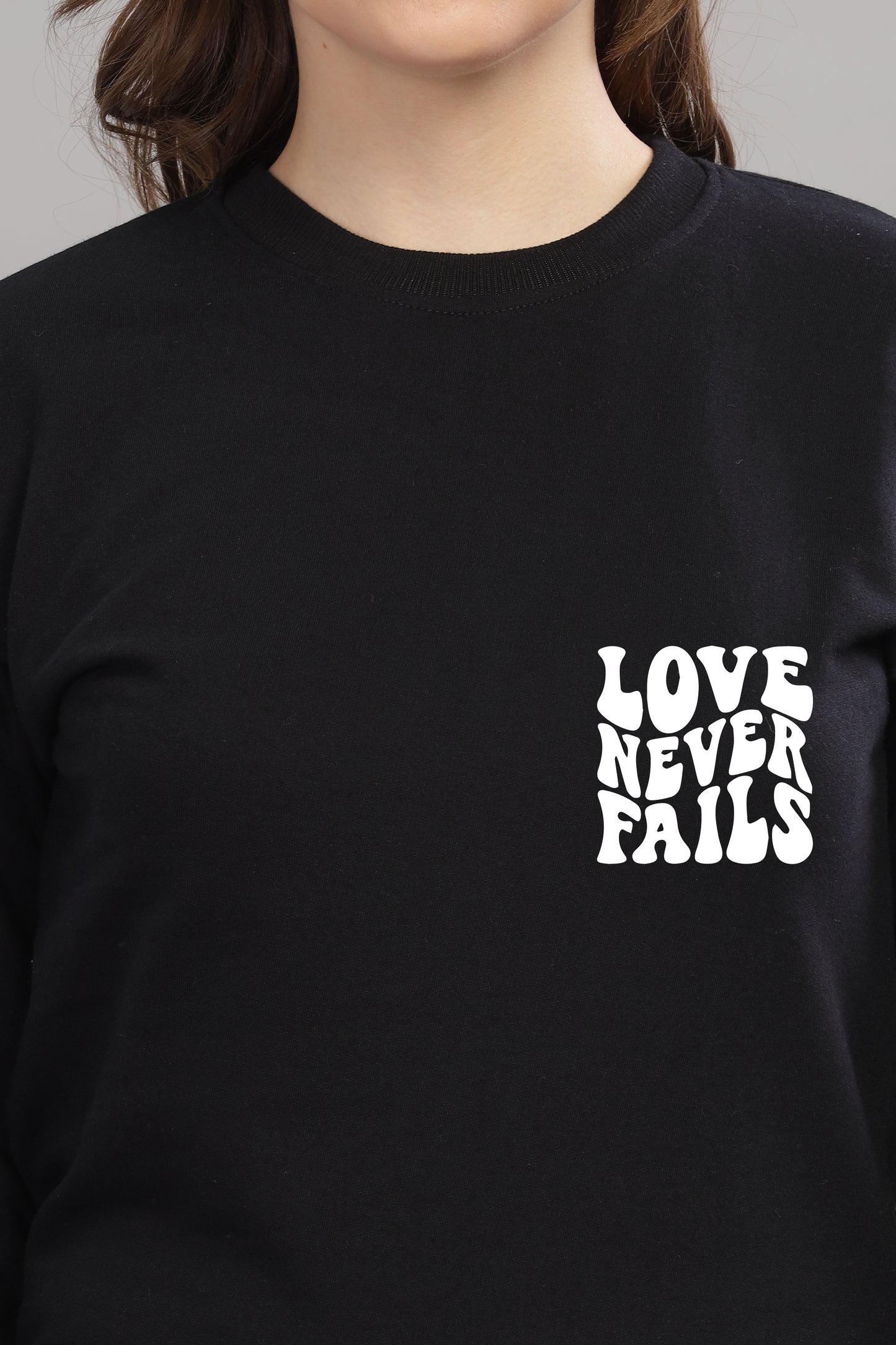 Love Never Fails Women’s Sweatshirt | Cozy & Stylish