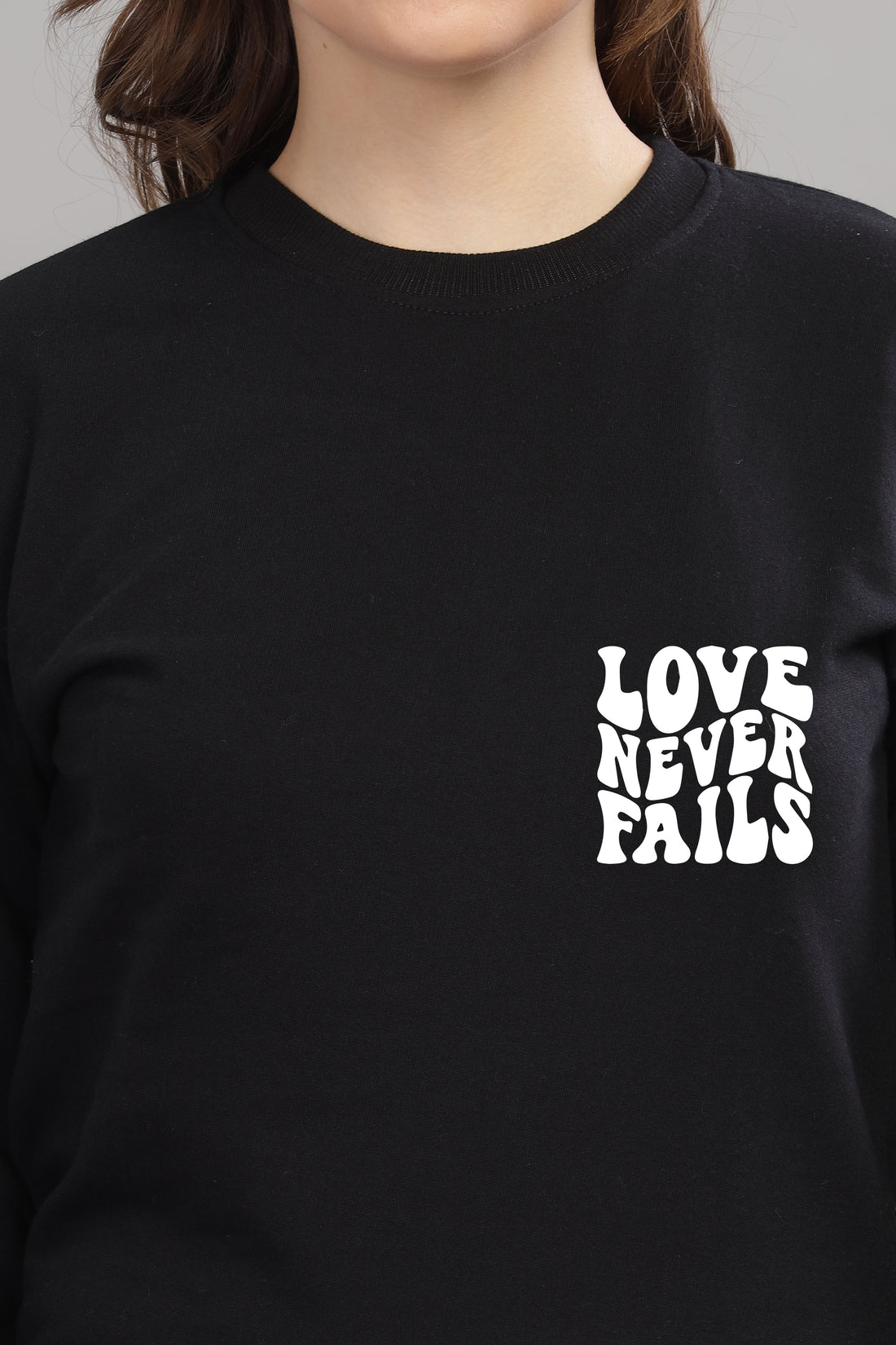 Love Never Fails Women’s Sweatshirt | Cozy & Stylish